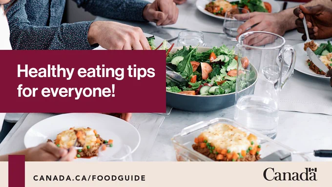 A group of adults sharing a healthy meal at home. Text reads: Healthy eating tips for everyone!