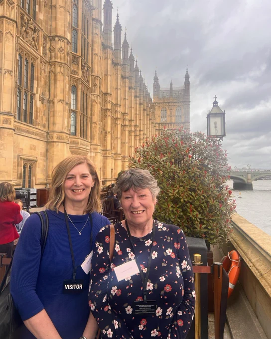 Liz (right) with Dianne Presha standing outside Parliament