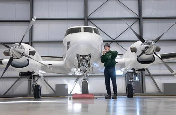 Student working on a small plane