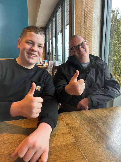 Martin and Dean giving thumbs up. 