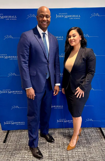 Director Rossi and US Attorney Buchanan (Georgia) pose in front of step and repeat. 