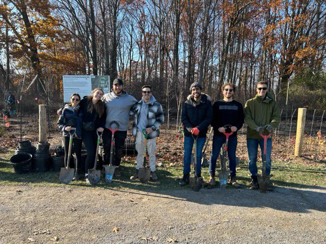 Tree planting volunteers on a sunny day in Hamilton, Ontario, Canada.