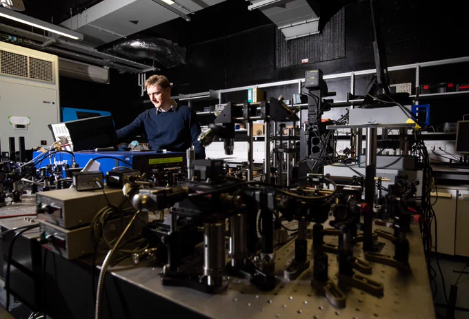Man in lab with various scientific instruments