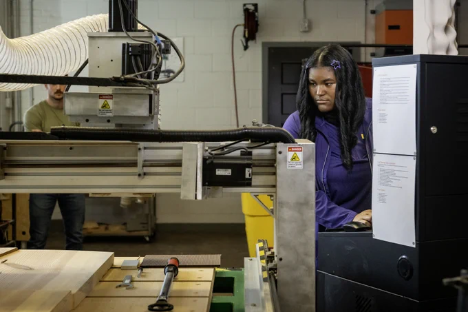 photo of Calcea Johnson working with equipment in one of LSU's student labs 