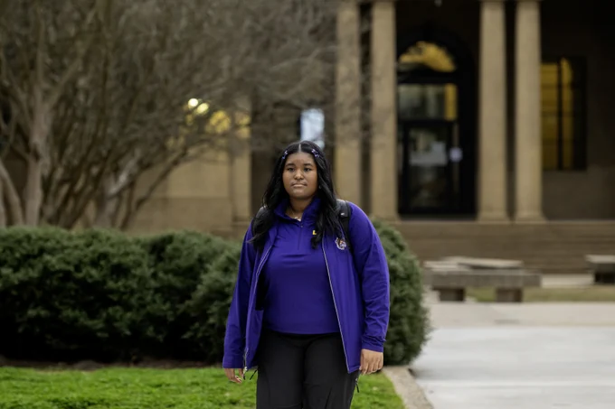 photo of Calcea Johnson walking in the Quad on LSU's campus