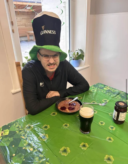 A resident wearing a Guinness hat. 