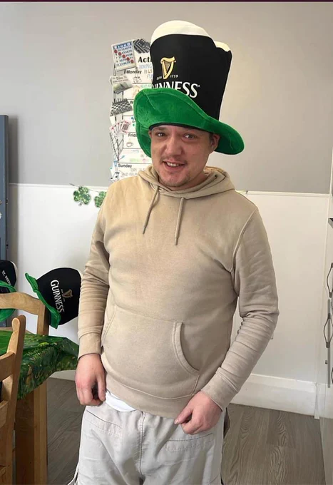 A resident wearing a Guinness hat. 
