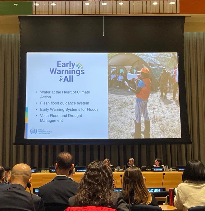 Picture of a screen at the UN with a graphic with the following:

Early Warnings for All

• Water at the Heart of Climate
Action
• Flash flood guidance system
• Early Warning Systems for Floods
• Volta Flood and Drought
Management