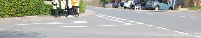 Children being taught in Ware. Picture shows a t junction the learners are visible but no heads in photo.