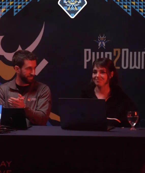 chompie smiling after her exploit was successful at Pwn2Own