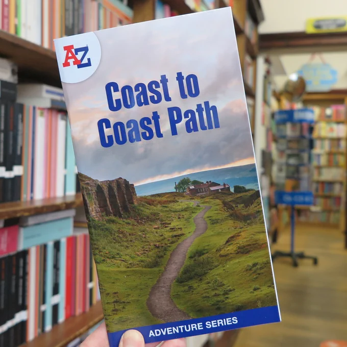 A-Z Coast to Coast Path (Adventure Series) with blurry bookshelves behind