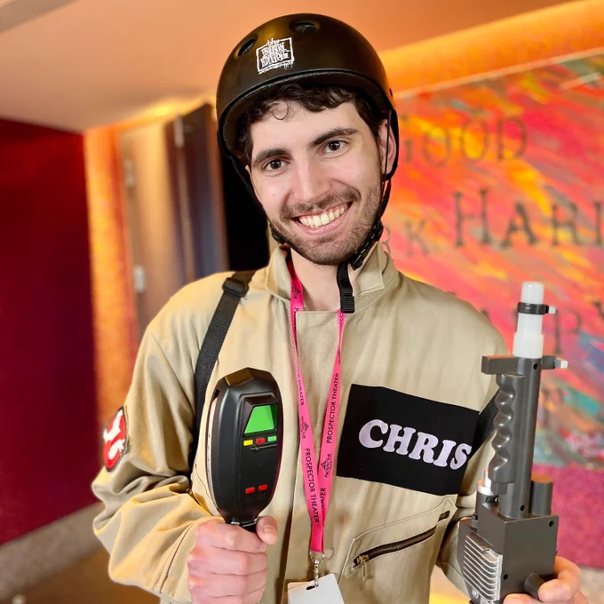 A close up image shows Chris in his costume.