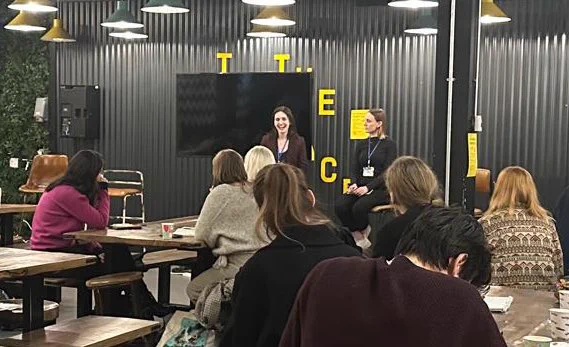 Caroline and Niamh in front of audience members
