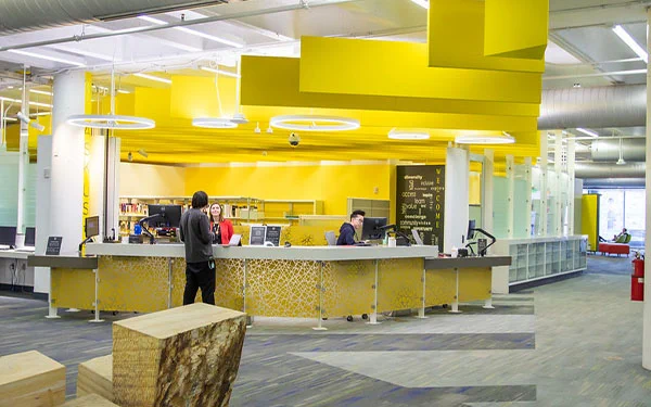 User gets help at the Auraria Library Ask Us Desk