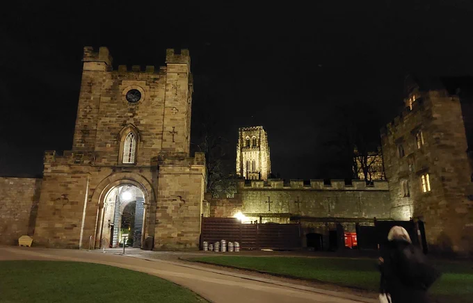 Durham Castle gatehouse at night. Cathedral Tower also visible. 