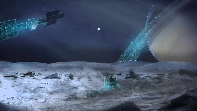 In the foreground is a grey icy surface, with a small spacecraft stood on the surface. In the background on the right is the planet Saturn. At the top left is an orbiting spacecraft. The surface spacecraft, orbiting spacecraft and Saturn are all partly drawn with blue lines, indicating that they are a future concept.