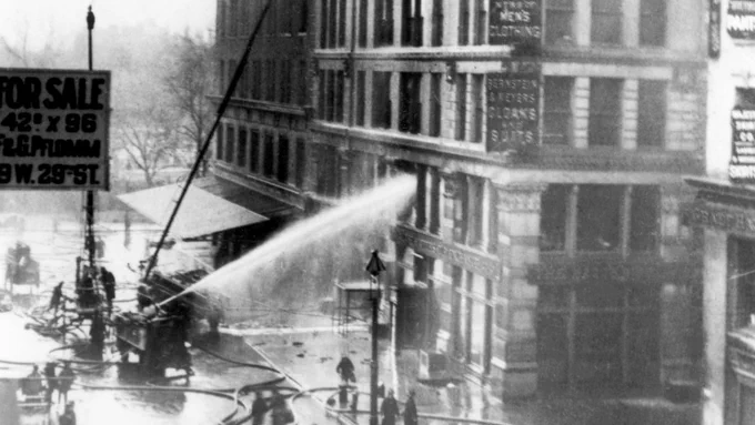 Firefighters attempt to extinguish flames on the lower floor of the Triangle building. Courtesy of the City Reliquary.