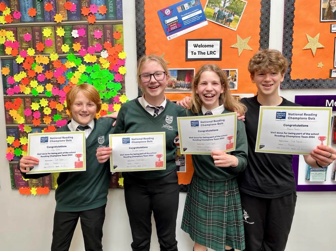 photos of students holding awards