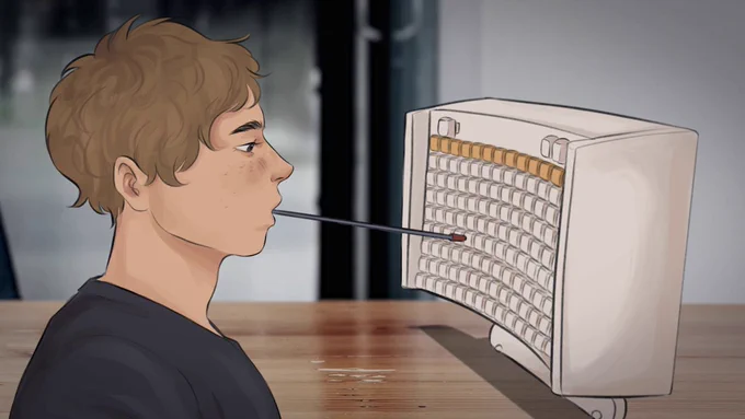 A man uses a mouth stick to type