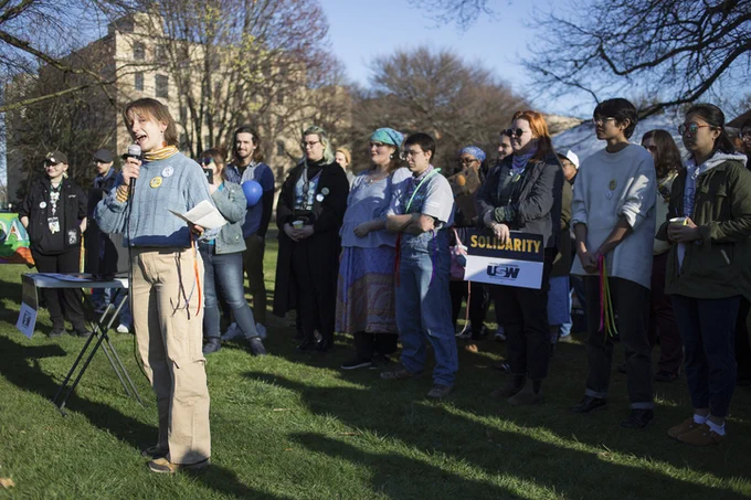Photo: Worker speaking at Children's Museum rally