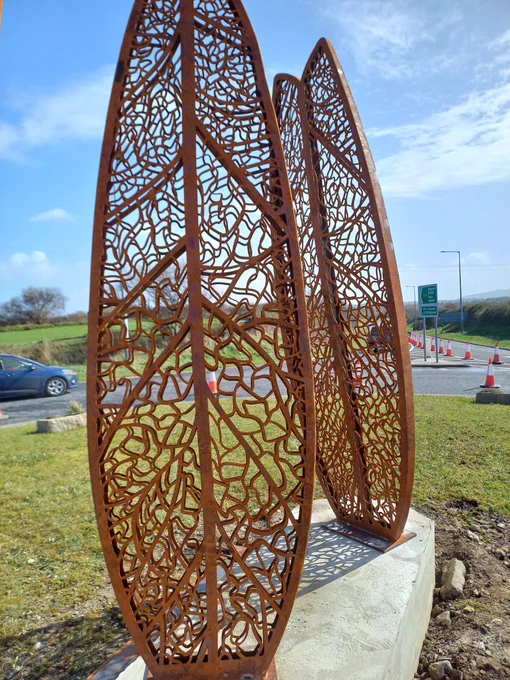 21 feet tall, corten windsail. Leaf pattern 