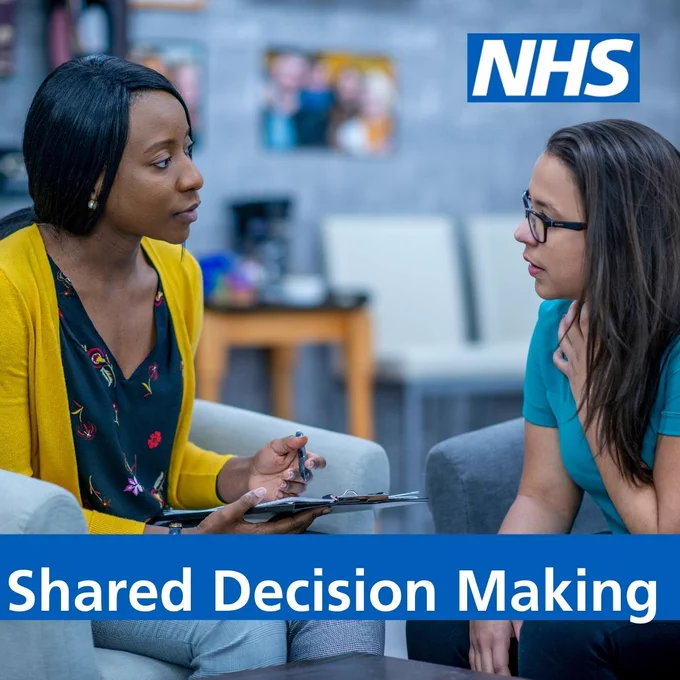 NHS logo top right. Image of two people speaking, one with a clip board sitting on sofas. Words: Shared Decision Making on a blue background in white writing.