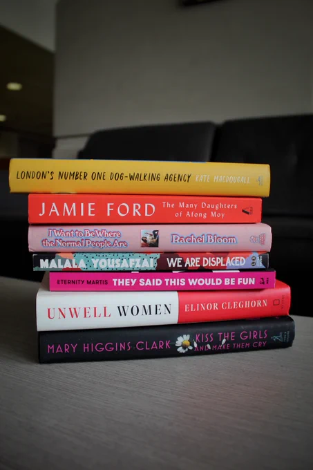Seven books stacked on top of one another. All by/about women for Women's History Month 