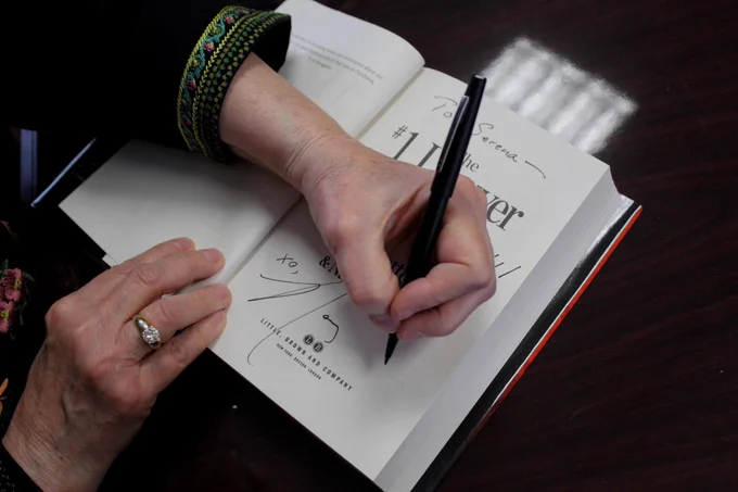 MSU Alumni and author Nancy Allen signing copies of her new book "#1 Lawyer" 
