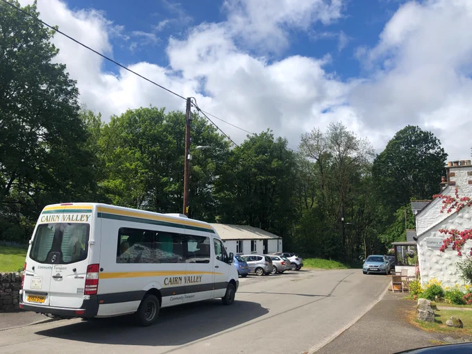 A Cairn Valley bus driving along the spring fling route