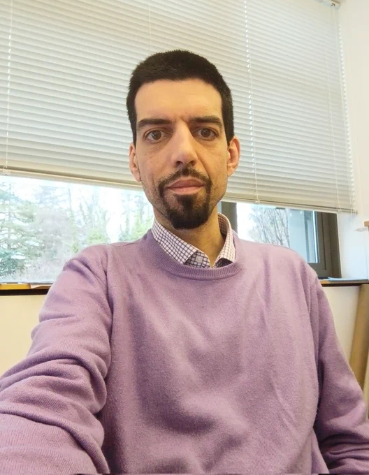 A selfie wearing purple