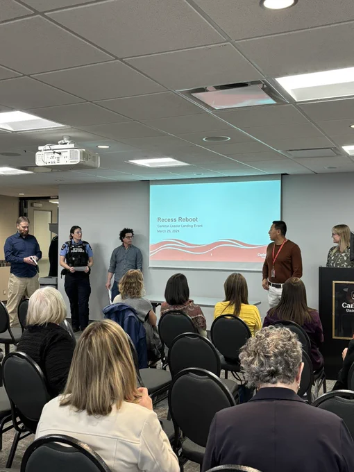 One of two Strategic impact Groups (SIG) from the Carleton Leader 2 cohort, presenting their work to the audience.
