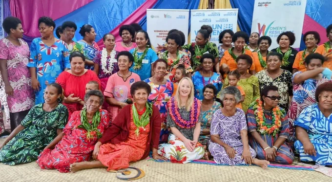 Group photo of women in Taci Village.