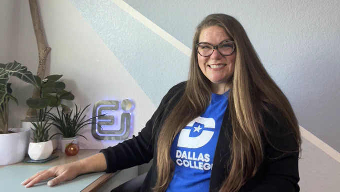 Photo of Dr. Pollock smiling while wearing her blue Dallas College shirt. 