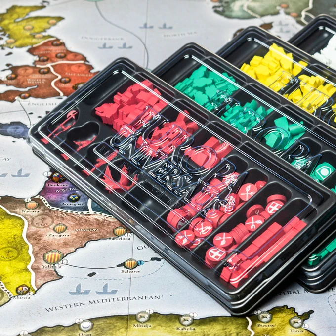 Storage player trays from Europa Universalis is spread out on the game board.