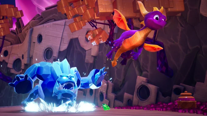 Screenshot from Spyro Reignited Trilogy showing the purple dragon flying away a icy blue crystal like enemy