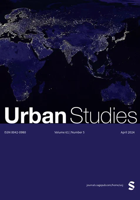 Urban Studies Journal cover. White heading text reads 'Urban Studies' and issue details are listed in fine text a banner below. Background is a map of the world at night with illuminated lights.
