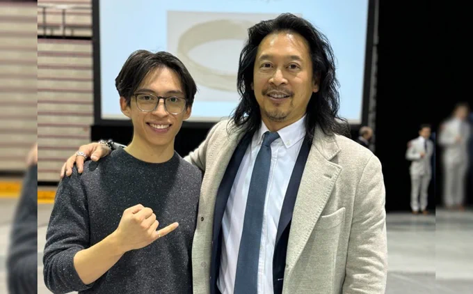 Michael and Sawyer Tang pose together at the Iron Ring ceremony