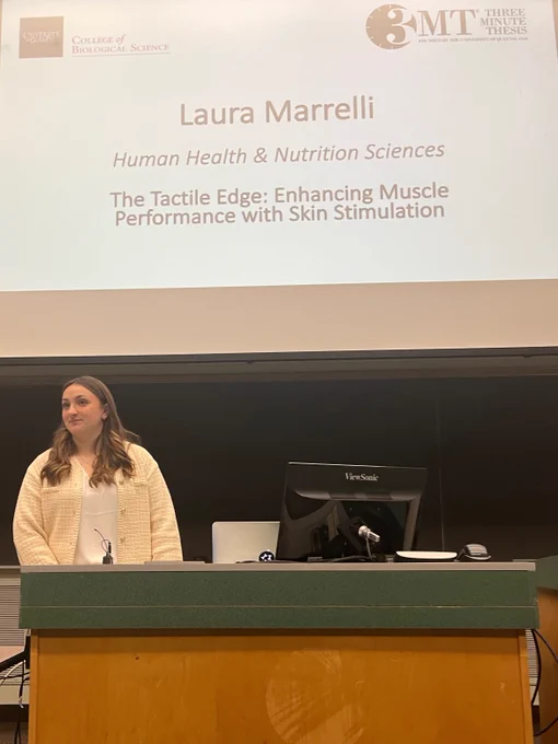 A photograph of Laura presenting in the 3MT competition.