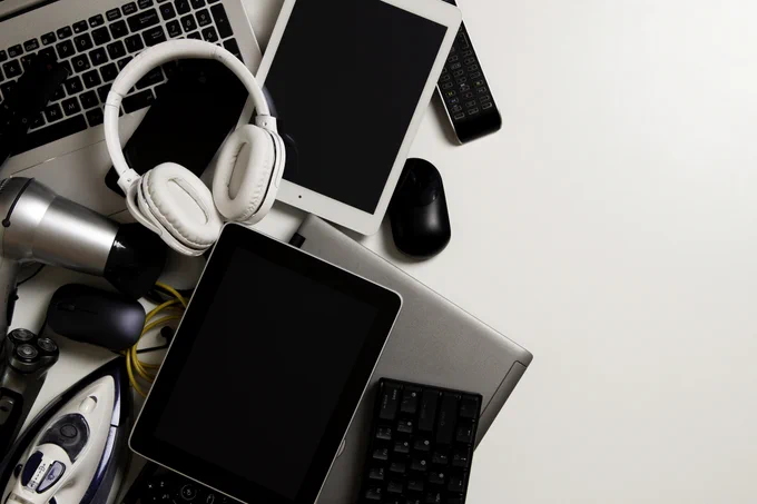 A photo of laptops, headphones, tablets, hairdryers and other electrical equipment