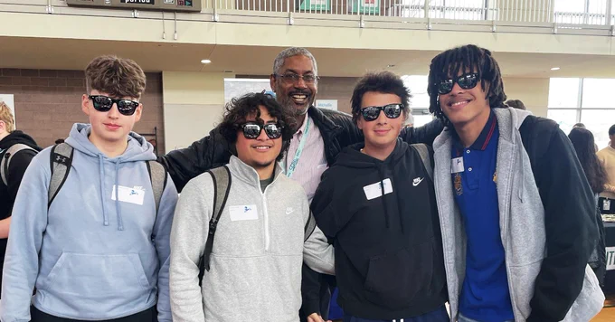 FEC staff with four students