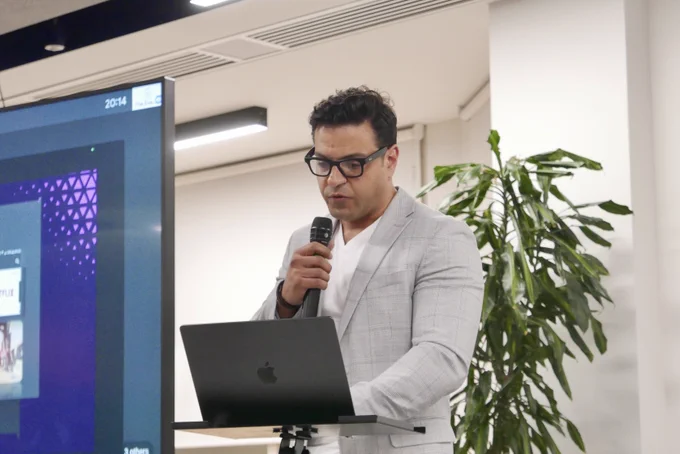 A photo of Mohamed speaking.