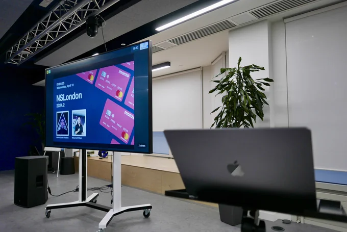 A photo of the intro slides on a monitor.