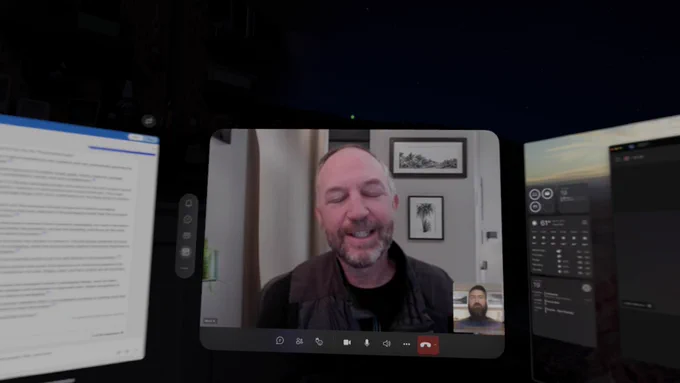 What John Moore saw when meeting with Mark Kashman during a normal Teams meeting. John joined the call using Teams from within the Vision Pro visionOS. Mark used a basic webcam - and you can tell he's closing his eyes to visualize what it would be like to also be wearing a Vision Pro. 