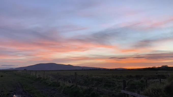 a sunset sky with Criffel in the background by Megan Grisewood-Foley
