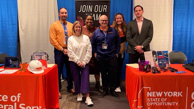 Members of Team OGS pose for a photo at the booth during the 2024 Dr. King Career Fair at the Empire State Plaza Convention Center in Albany, NY.
