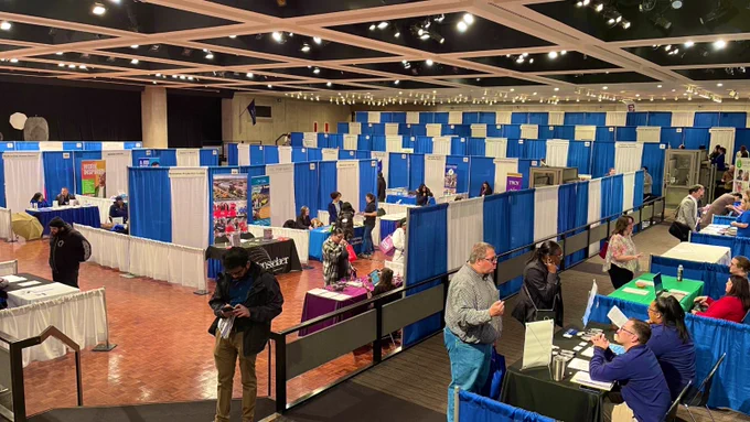 The Empire State Plaza Convention Center is lined with booths for the Dr. king Career Fair.