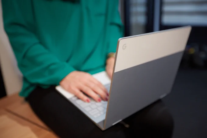Person typing on chromebook