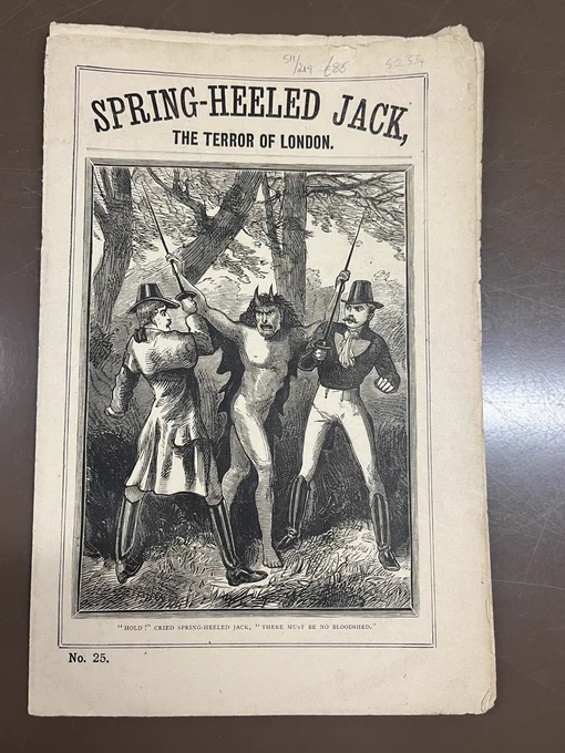 This piece is a penny dreadful published around 1890 of Spring-Heeled Jack, a popular Victorian urban legend who stalked the streets of London. On the cover of this penny dreadful, Jack is depicted as a diabolical figure with horns and a nasty snarl, wearing a black cloak. Two gentlemen appear frightened as Jack holds onto their swords, blocking their attempt to stop him. 