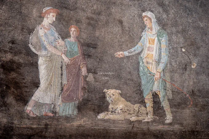 Helen on left, with red hair and blue dress, looks across at Paris on right, in 'Eastern' dress. Between them sits an unhappy dog who looks out at the viewer, while a maid looks up at Helen.