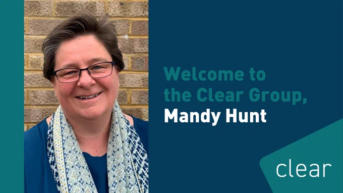 Picture of Mandy Hunt with an announcement, welcoming her to the Clear Group